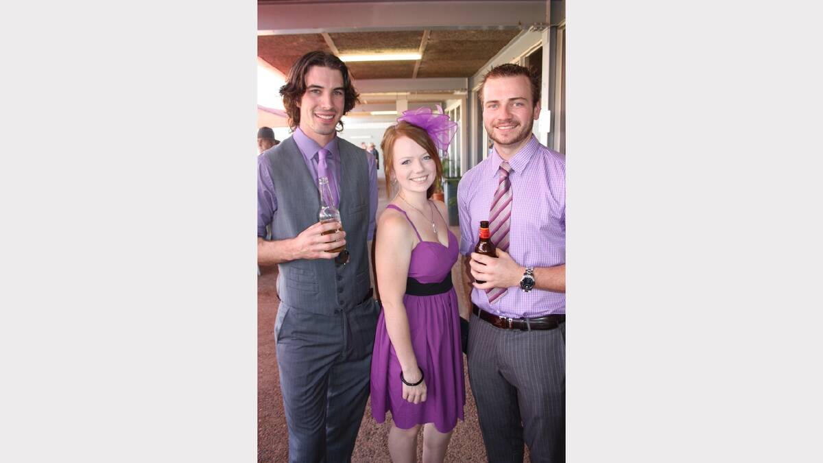 PRETTY IN PURPLE: Looking dashing in purple are, from left, Daniel Evans, Kaydee Grant and Aaron Grant.