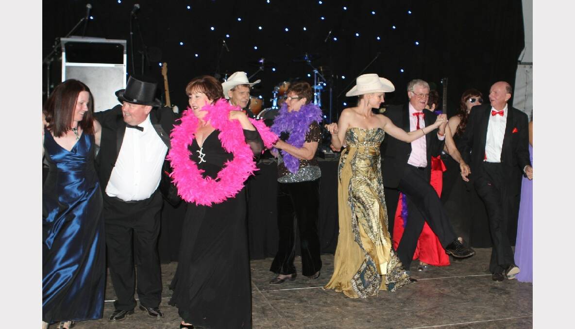 Getting into the rodeo spirit at the Isa Rodeo Queen Quest Ball on Saturday night.