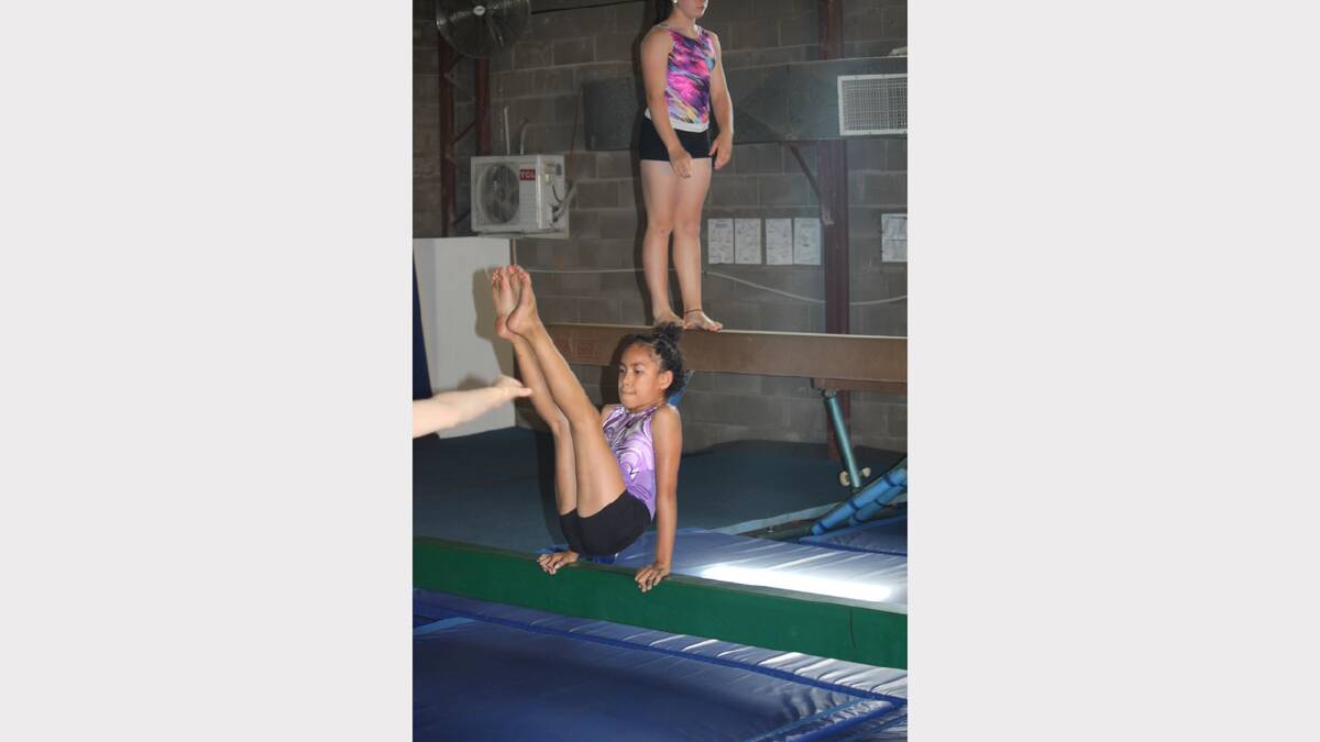 HOLDING ON: Julia Temo, 8, steadies herself on the beam.